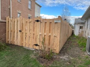 Kenosha Fence Contractor 6  Scallop Board on Board Kenosha WI Ken Reed Outside view with gate 300x225